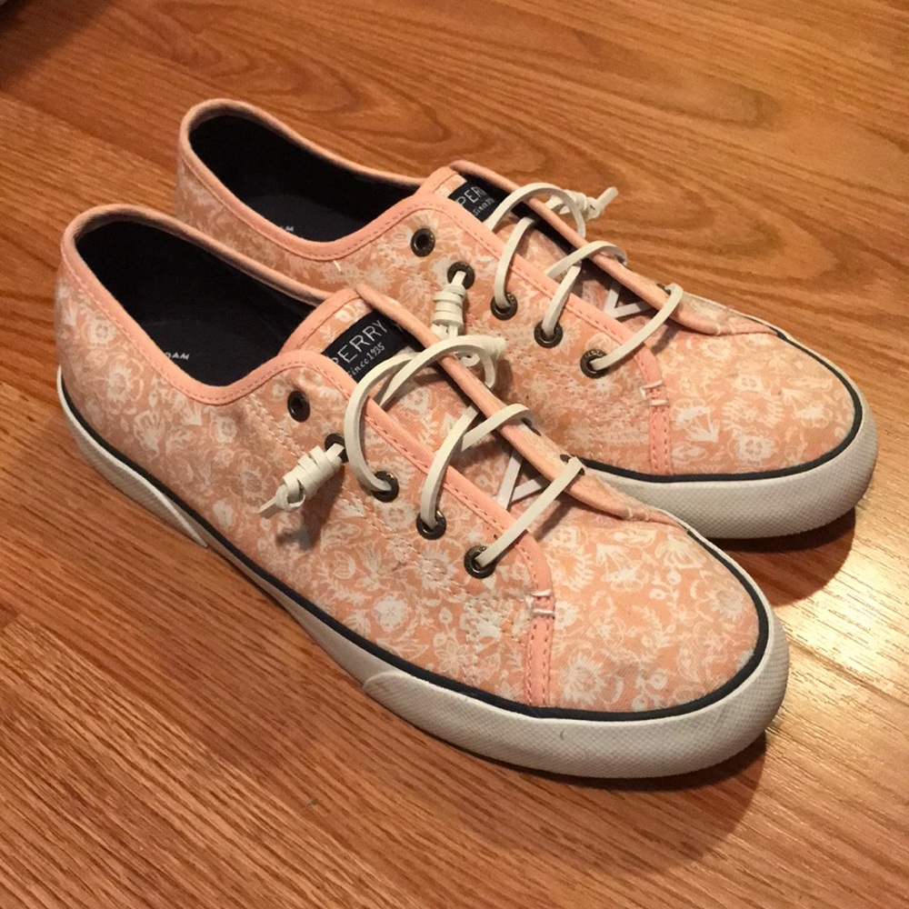 Sperry slip on sneakers.